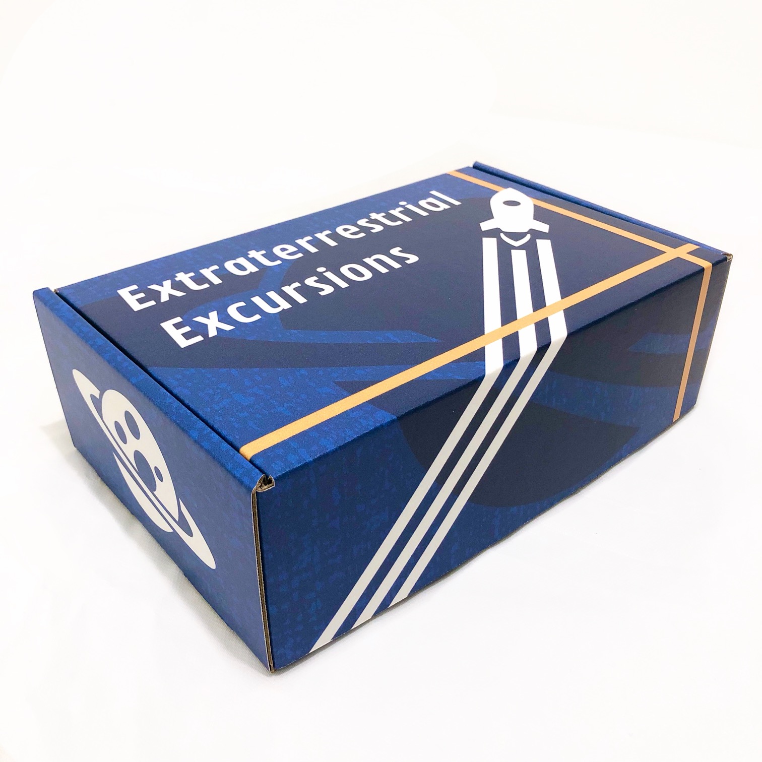 A left-angled shot of the front of a blue, space-themed mailer box.